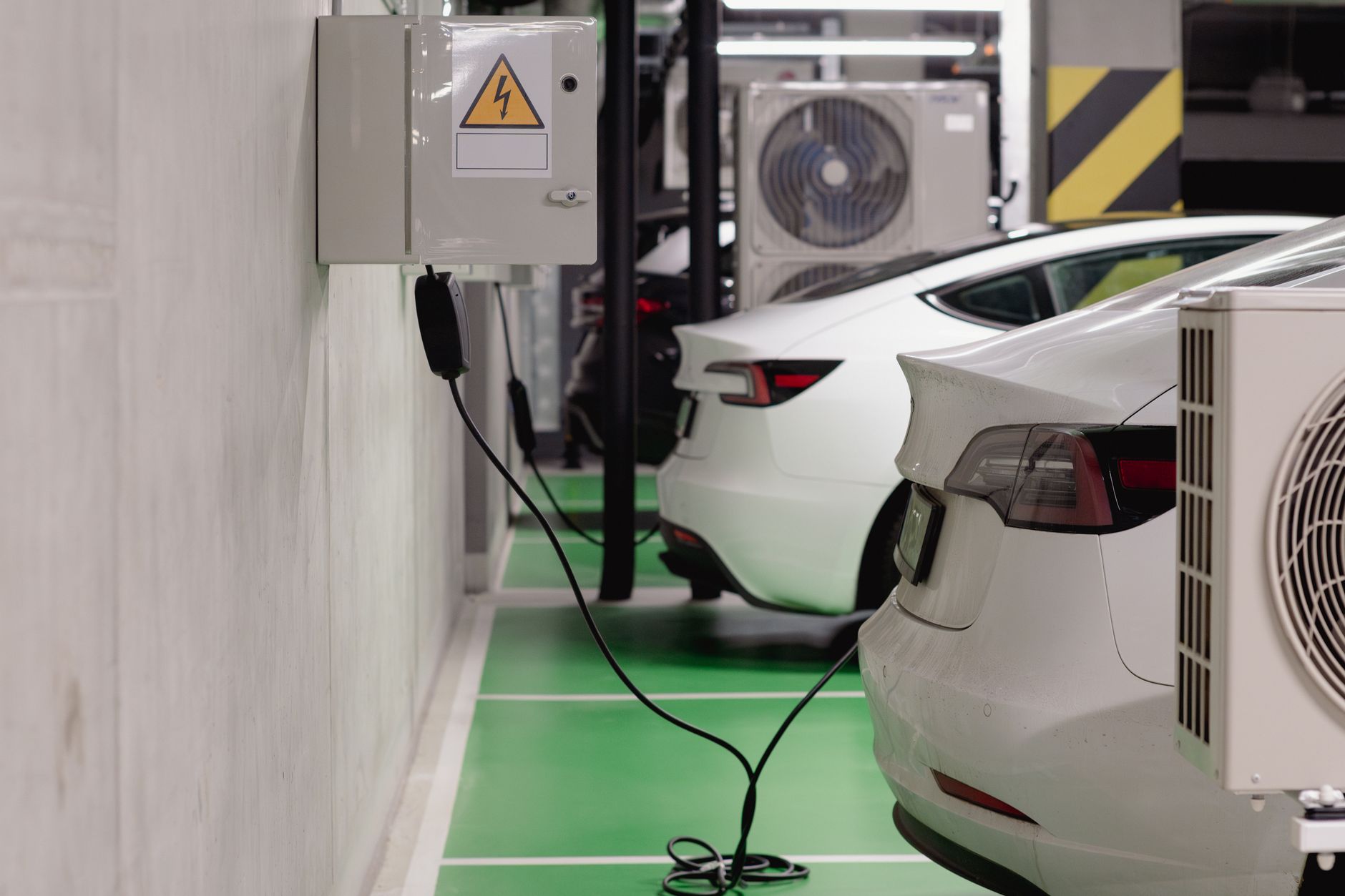 Anker SOLIX F3800 power station placed on garage floor near an electrical panel