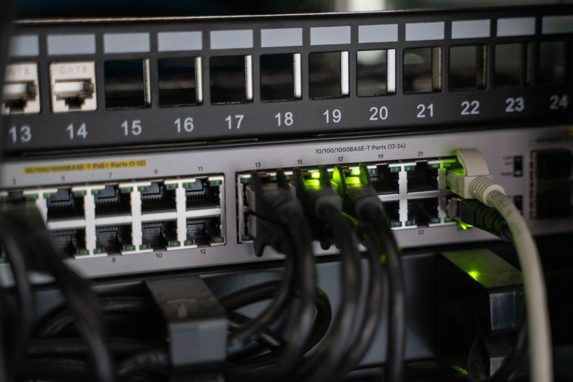 CyberPower UPS unit plugged into a home office router and desktop computer