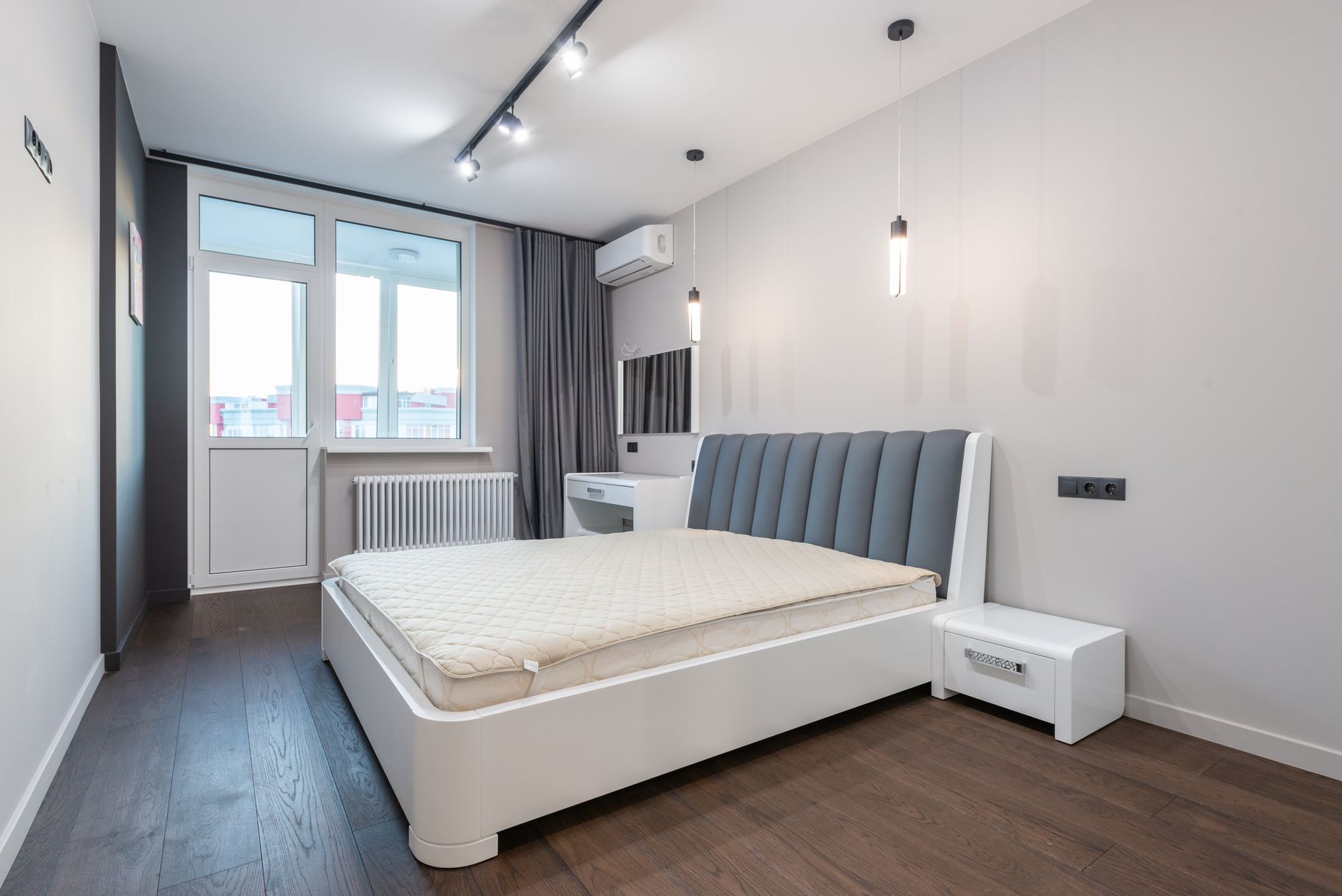 a carbon monoxide detector mounted on a bedroom wall