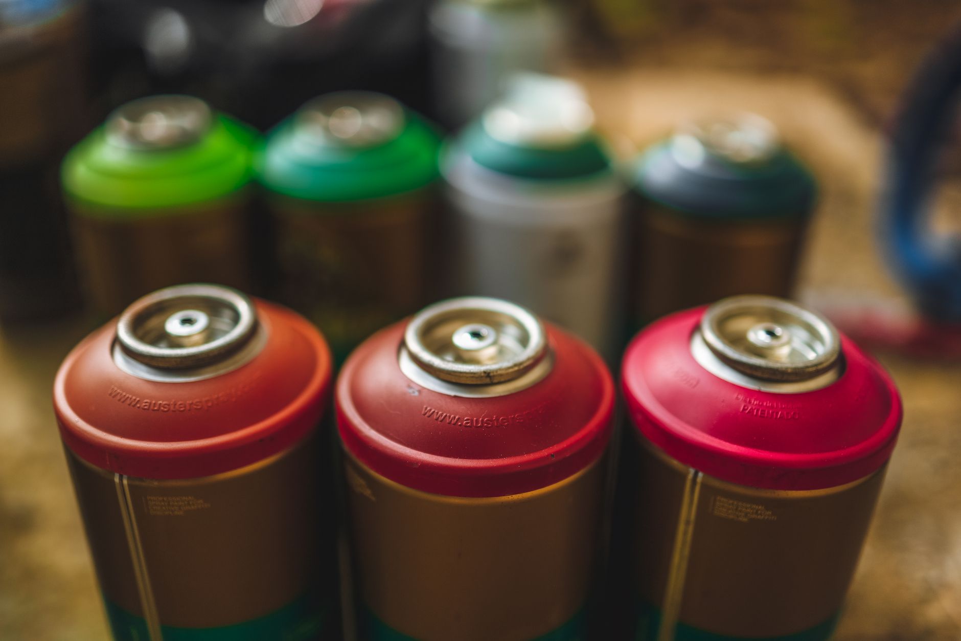 red fuel cans stored safely outside in a shed